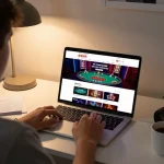 Engaged user placing bets on 壹發娛樂 online casino platform from comfortable home office, showcasing modern setup